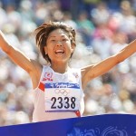 Naoko Takahashi of Japan wins the women's marathon final with a new Olympic record time of 2:23:14 at the Summer Olympics Sunday, Sept. 24, 2000, at Olympic Stadium in Sydney. (AP Photo/Doug Mills)